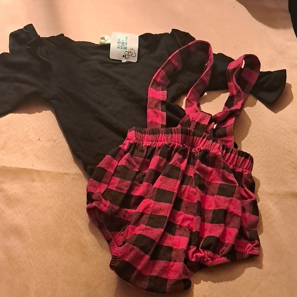 Black One Piece With Red And Black Jumper